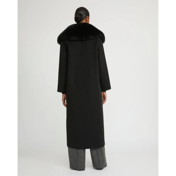 Woman wearing Yves Salomon shearling fur coat – luxury outerwear at Coveti