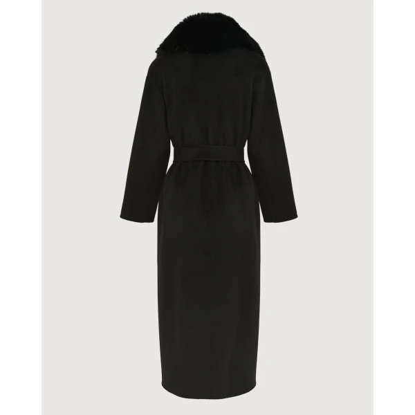 Woman wearing Yves Salomon shearling fur coat – luxury outerwear at Coveti