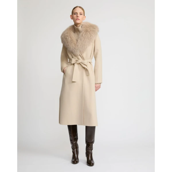 Woman wearing Yves Salomon shearling fur coat – luxury outerwear at Coveti