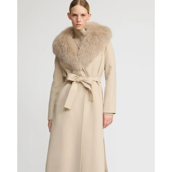 Woman wearing Yves Salomon shearling fur coat – luxury outerwear at Coveti