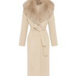 Woman wearing Yves Salomon shearling fur coat – luxury outerwear at Coveti