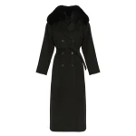 Woman wearing Yves Salomon shearling fur coat – luxury outerwear at Coveti