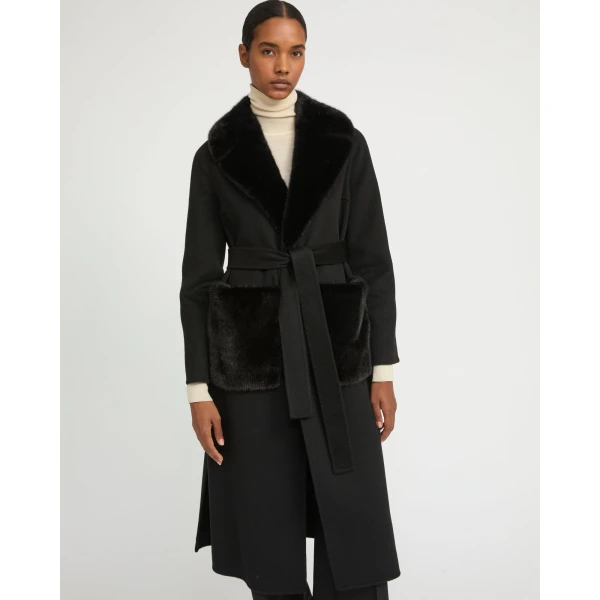 Woman wearing Yves Salomon shearling fur coat – luxury outerwear at Coveti