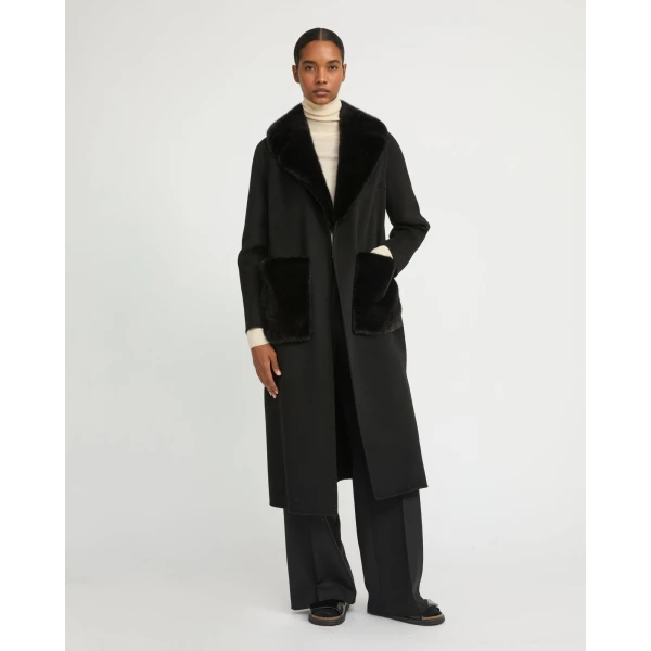 Woman wearing Yves Salomon shearling fur coat – luxury outerwear at Coveti