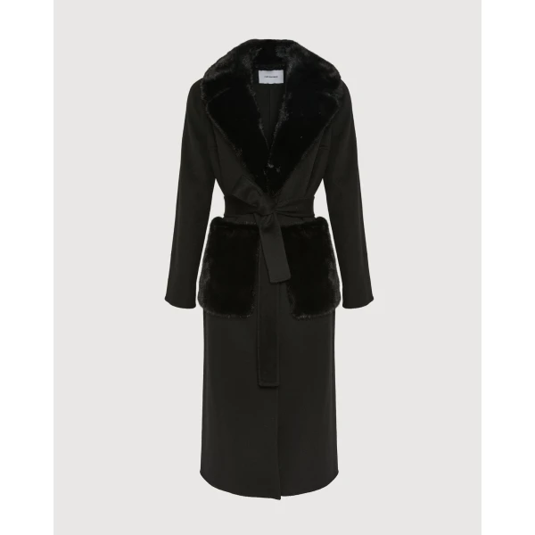 Woman wearing Yves Salomon shearling fur coat – luxury outerwear at Coveti