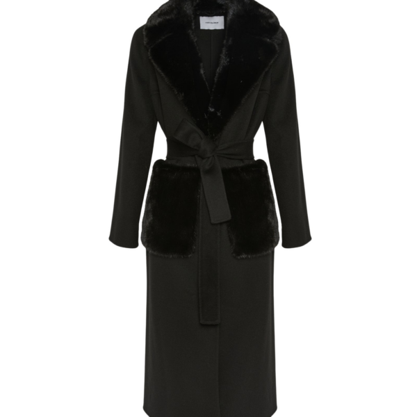 Woman wearing Yves Salomon shearling fur coat – luxury outerwear at Coveti
