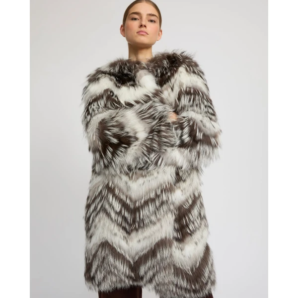 Woman wearing Yves Salomon shearling fur coat – luxury outerwear at Coveti
