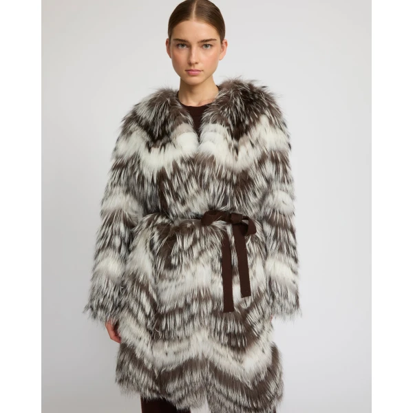 Woman wearing Yves Salomon shearling fur coat – luxury outerwear at Coveti