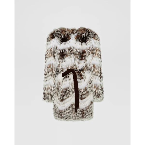 Woman wearing Yves Salomon shearling fur coat – luxury outerwear at Coveti