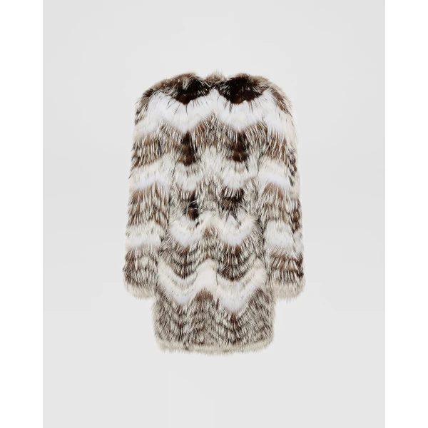 Woman wearing Yves Salomon shearling fur coat – luxury outerwear at Coveti