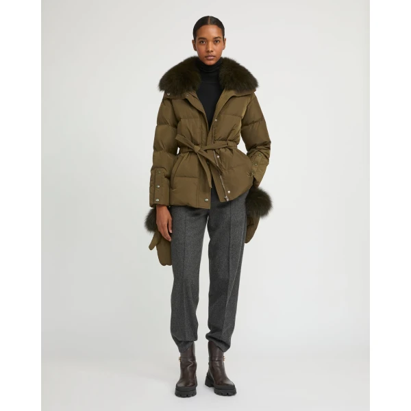 Woman wearing Yves Salomon shearling fur coat – luxury outerwear at Coveti