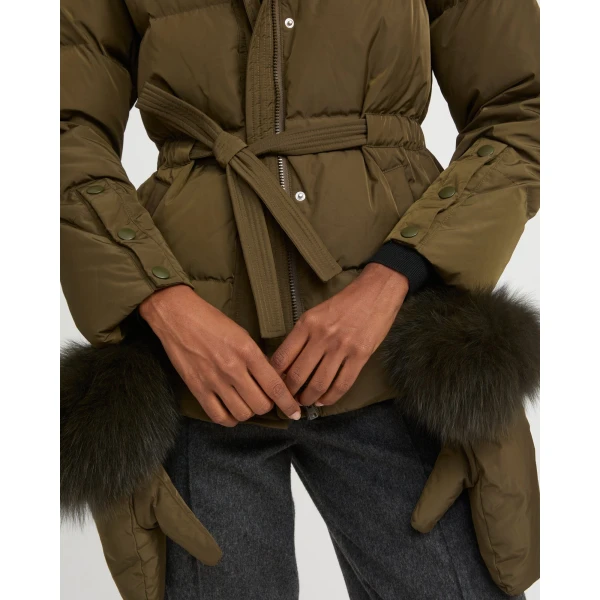 Woman wearing Yves Salomon shearling fur coat – luxury outerwear at Coveti
