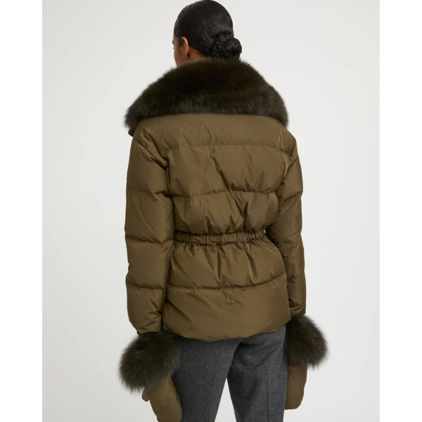 Woman wearing Yves Salomon shearling fur coat – luxury outerwear at Coveti
