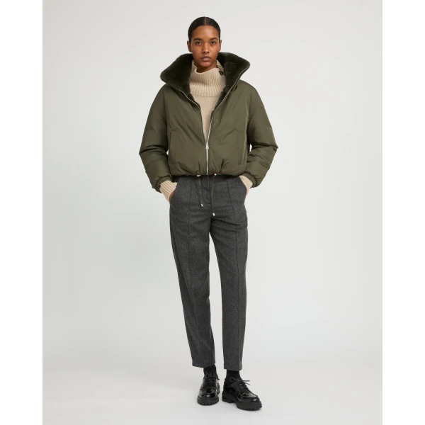 Woman wearing Yves Salomon shearling fur coat – luxury outerwear at Coveti