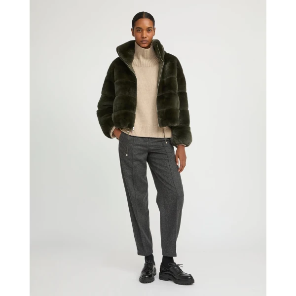 Woman wearing Yves Salomon shearling fur coat – luxury outerwear at Coveti