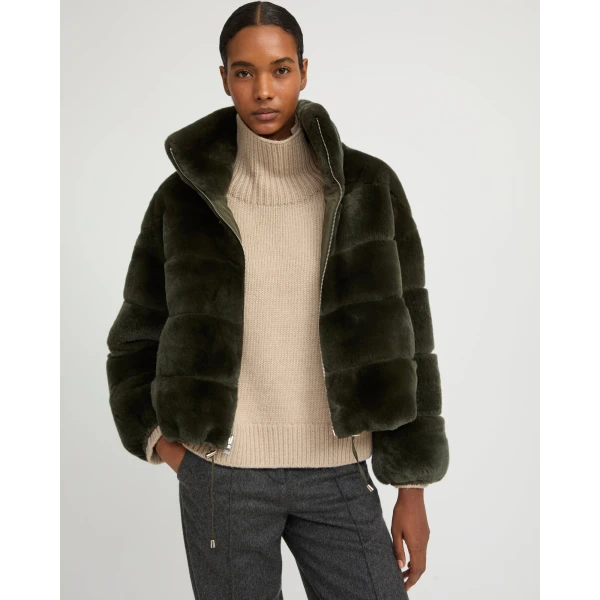 Woman wearing Yves Salomon shearling fur coat – luxury outerwear at Coveti