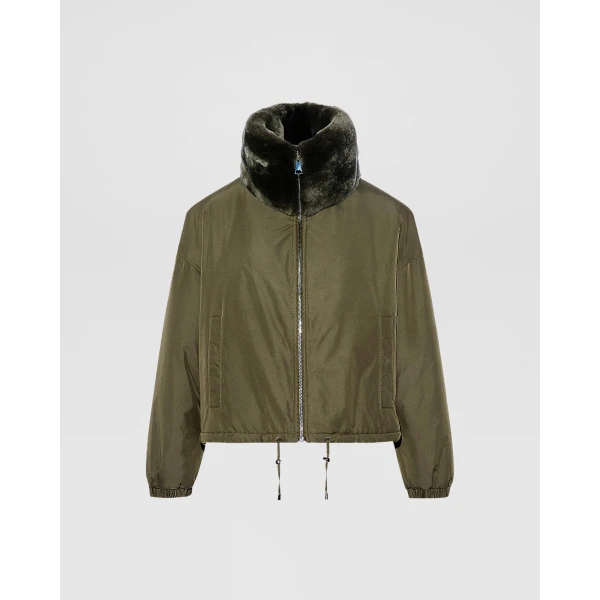 Woman wearing Yves Salomon shearling fur coat – luxury outerwear at Coveti