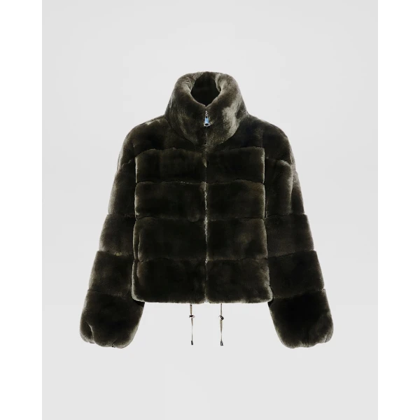 Woman wearing Yves Salomon shearling fur coat – luxury outerwear at Coveti