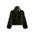 Woman wearing Yves Salomon shearling fur coat – luxury outerwear at Coveti