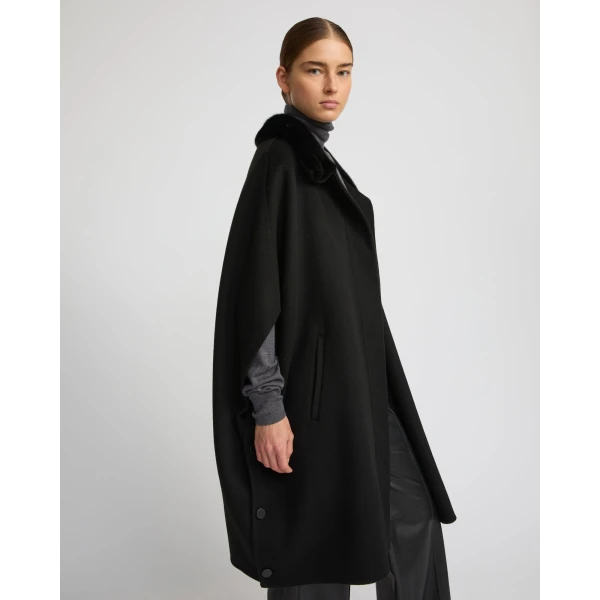Woman wearing Yves Salomon shearling fur coat – luxury outerwear at Coveti