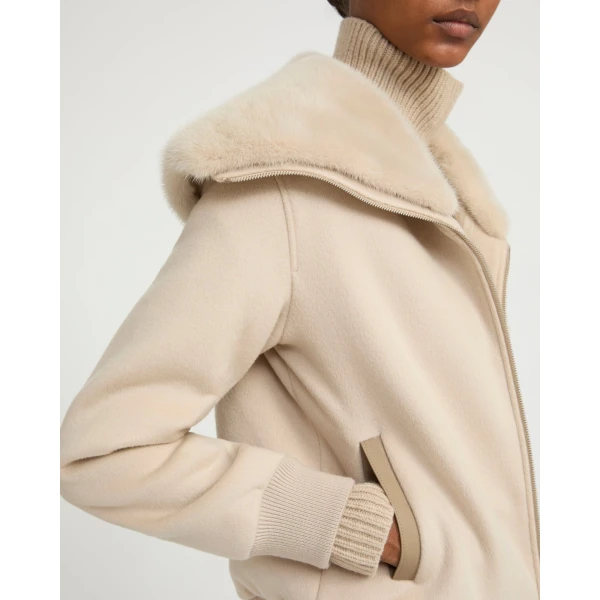Woman wearing Yves Salomon shearling fur coat – luxury outerwear at Coveti