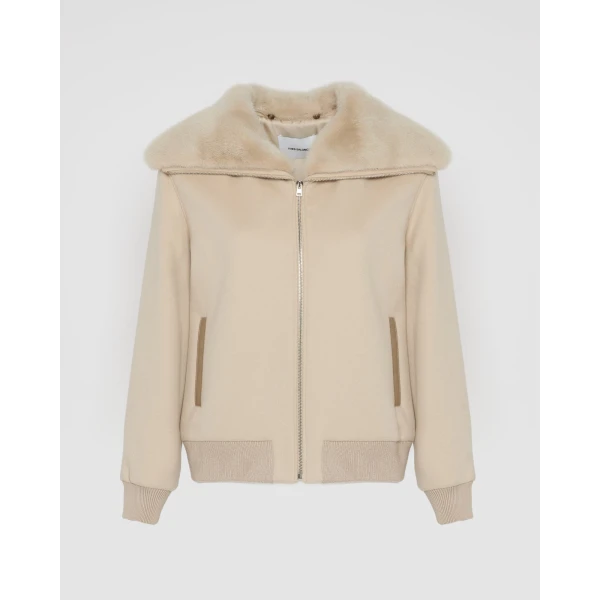 Woman wearing Yves Salomon shearling fur coat – luxury outerwear at Coveti