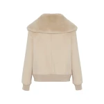Woman wearing Yves Salomon shearling fur coat – luxury outerwear at Coveti