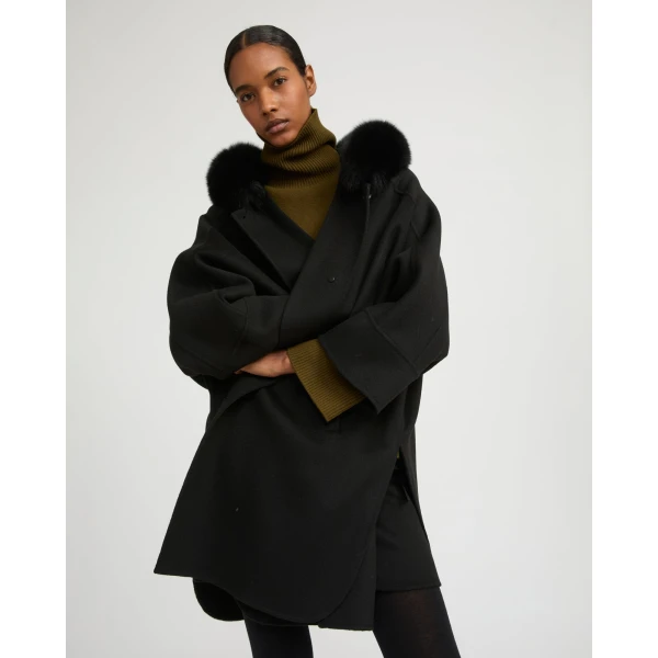 Woman wearing Yves Salomon shearling fur coat – luxury outerwear at Coveti