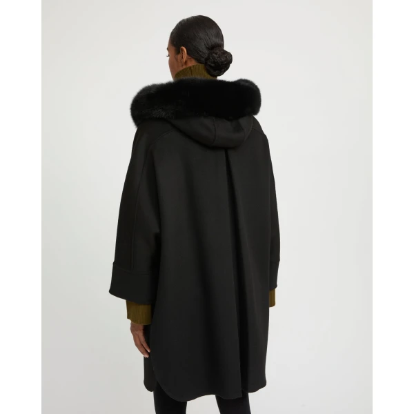 Woman wearing Yves Salomon shearling fur coat – luxury outerwear at Coveti