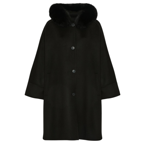 Woman wearing Yves Salomon shearling fur coat – luxury outerwear at Coveti