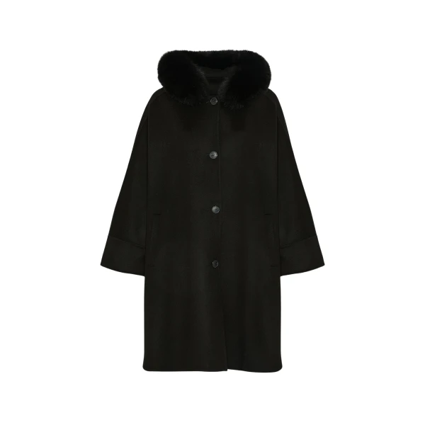 Woman wearing Yves Salomon shearling fur coat – luxury outerwear at Coveti
