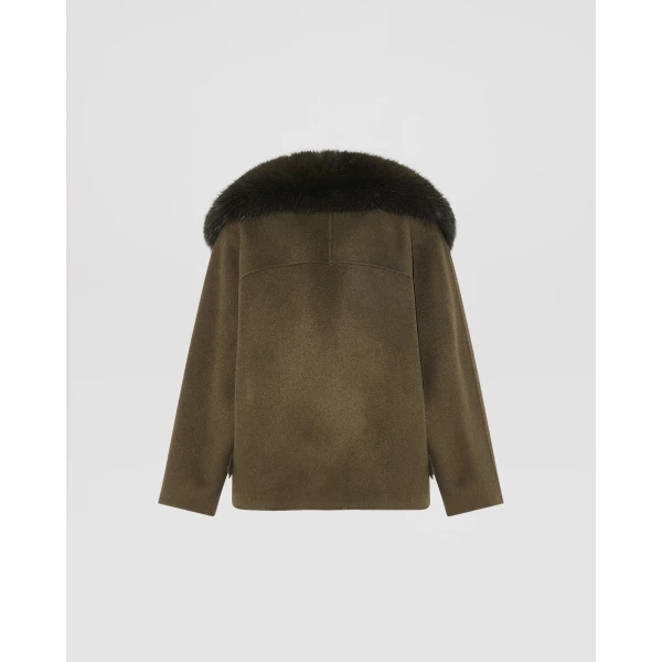 Woman wearing Yves Salomon shearling fur coat – luxury outerwear at Coveti