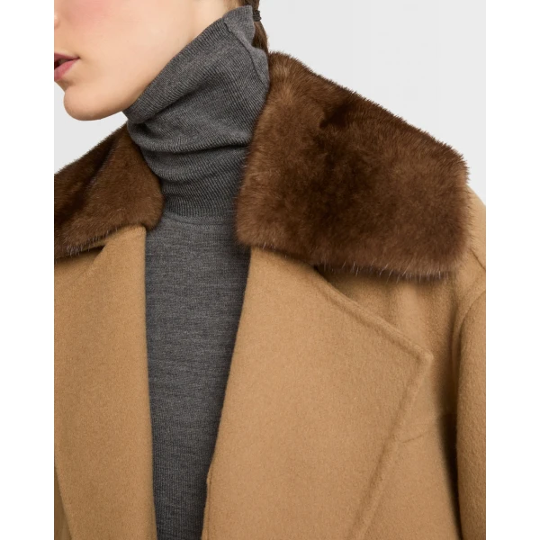 Woman wearing Yves Salomon shearling fur coat – luxury outerwear at Coveti