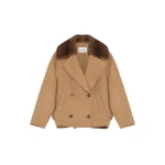 Woman wearing Yves Salomon shearling fur coat – luxury outerwear at Coveti