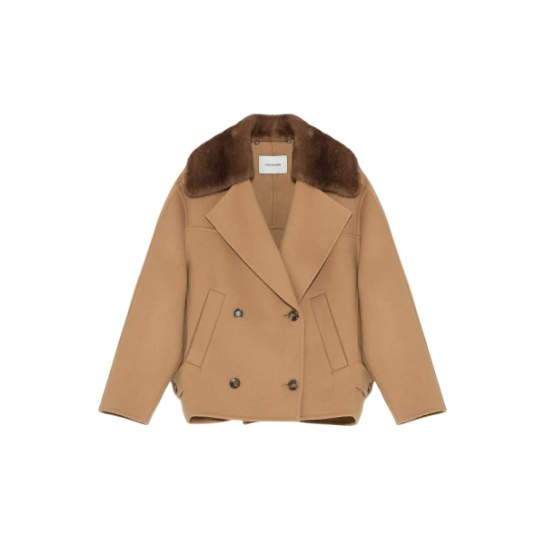 Woman wearing Yves Salomon shearling fur coat – luxury outerwear at Coveti