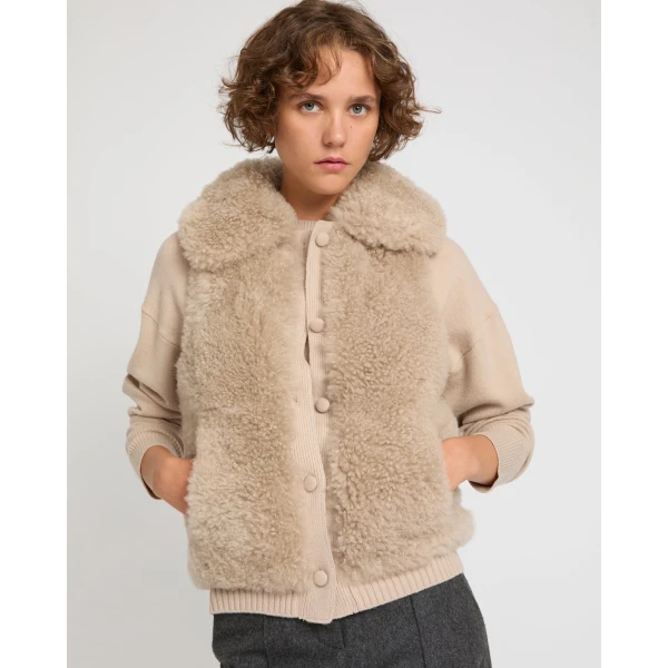 Woman wearing Yves Salomon shearling fur coat – luxury outerwear at Coveti
