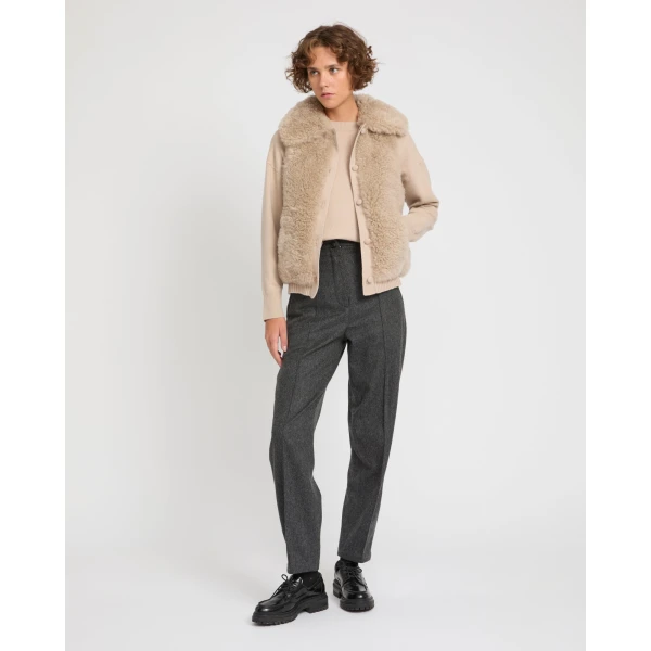 Woman wearing Yves Salomon shearling fur coat – luxury outerwear at Coveti