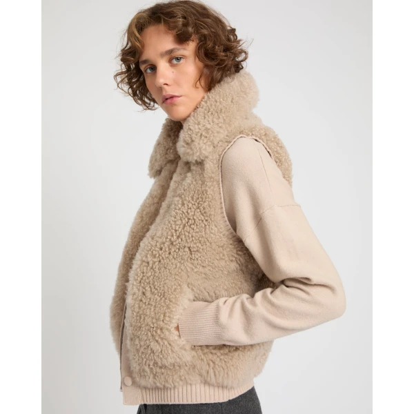 Woman wearing Yves Salomon shearling fur coat – luxury outerwear at Coveti