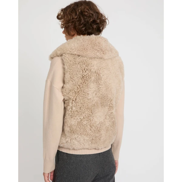Woman wearing Yves Salomon shearling fur coat – luxury outerwear at Coveti