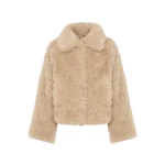 Woman wearing Yves Salomon shearling fur coat – luxury outerwear at Coveti
