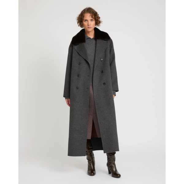 Woman wearing Yves Salomon shearling fur coat – luxury outerwear at Coveti