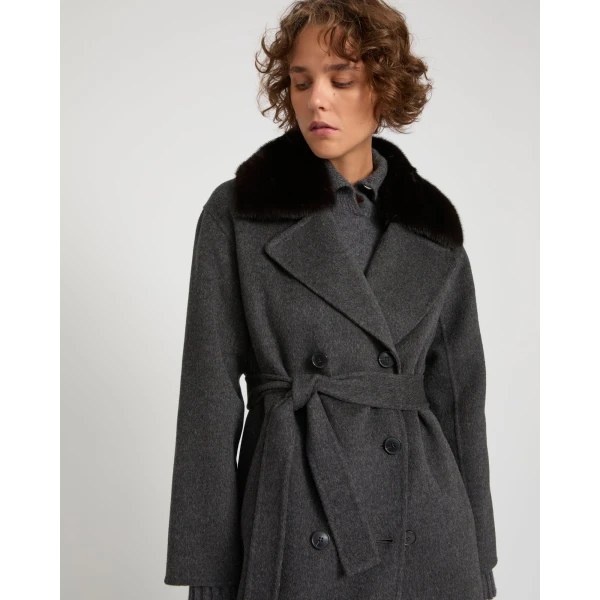 Woman wearing Yves Salomon shearling fur coat – luxury outerwear at Coveti