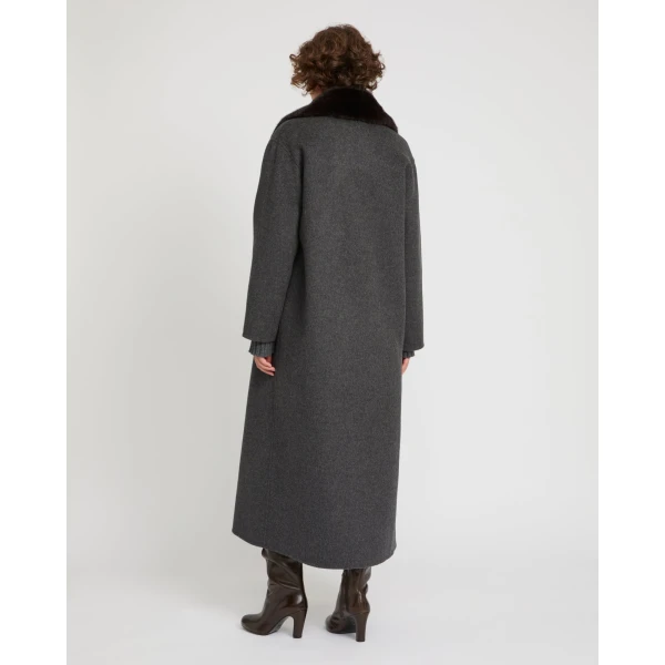 Woman wearing Yves Salomon shearling fur coat – luxury outerwear at Coveti