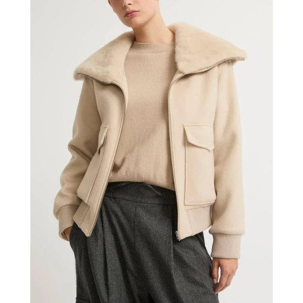 Woman wearing Yves Salomon shearling fur coat – luxury outerwear at Coveti