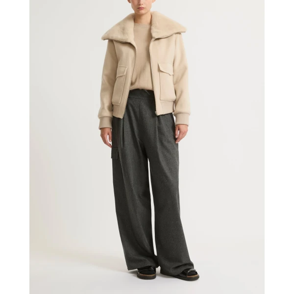 Woman wearing Yves Salomon shearling fur coat – luxury outerwear at Coveti
