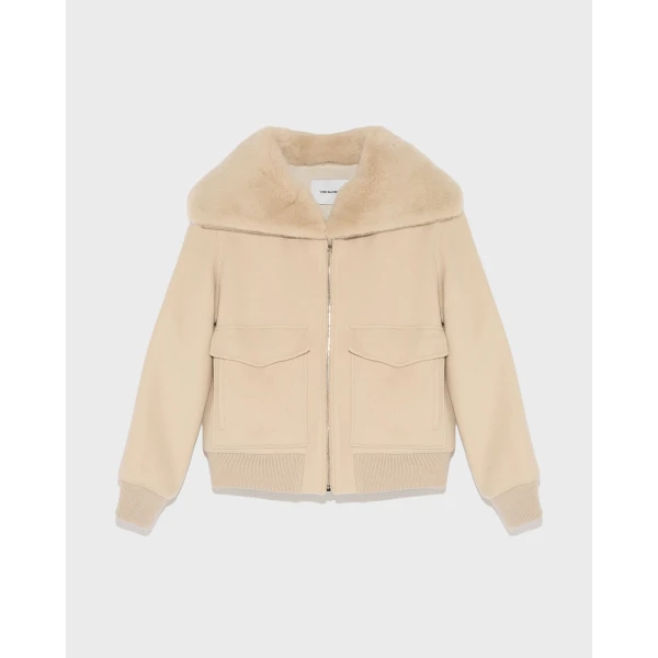 Woman wearing Yves Salomon shearling fur coat – luxury outerwear at Coveti