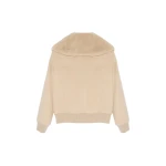 Woman wearing Yves Salomon shearling fur coat – luxury outerwear at Coveti