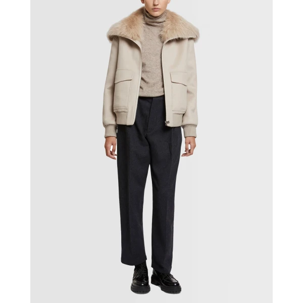 Woman wearing Yves Salomon shearling fur coat – luxury outerwear at Coveti