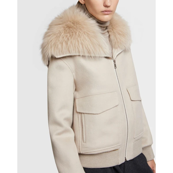 Woman wearing Yves Salomon shearling fur coat – luxury outerwear at Coveti