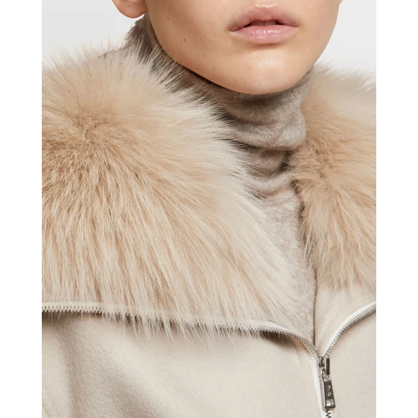 Woman wearing Yves Salomon shearling fur coat – luxury outerwear at Coveti